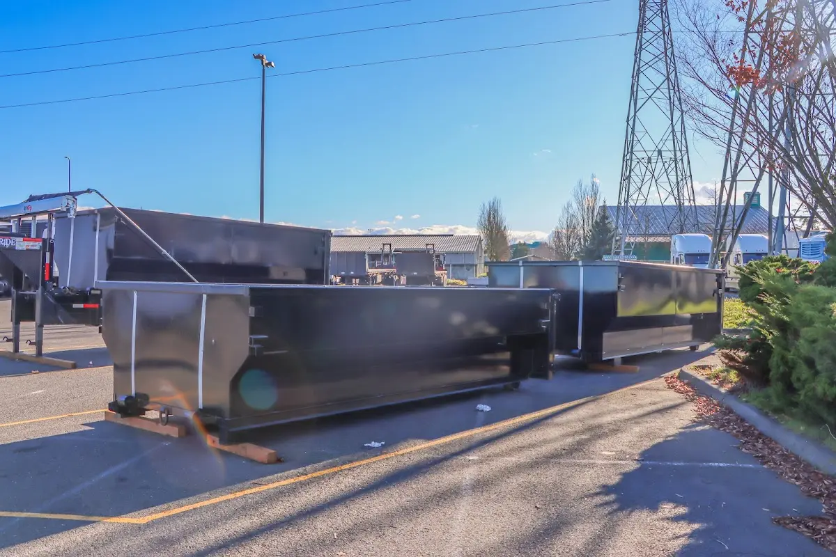 Roll-off dumpster ready for waste disposal at job site for 3 Yard Dumpster Rental in Broadview